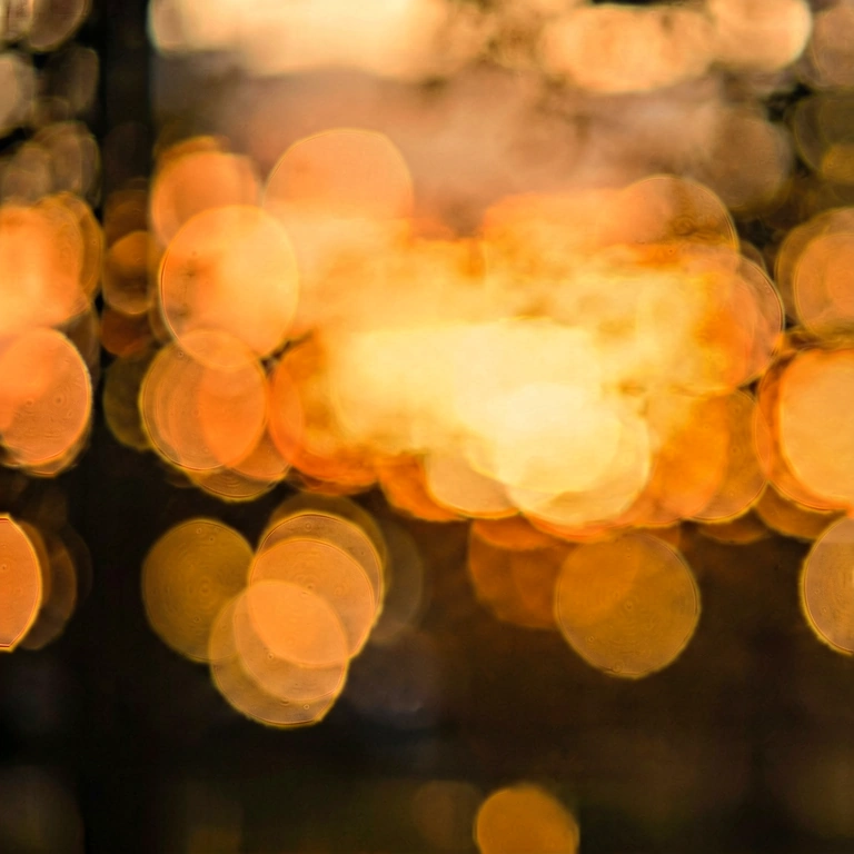 Dramatic warm light bokeh - bokeh backgrounds free stock photo